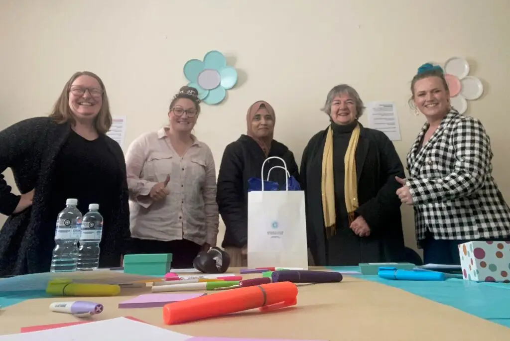 A group of women looking at the camera and smiling after a successful WIBAL event